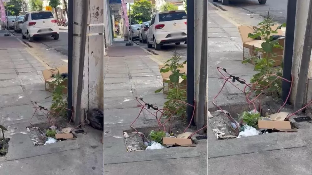 Fios soltos na calçada da Rua Rui Barbosa oferecem risco a pedestres no Centro de Patos; Energisa diz que cliente foi notificado