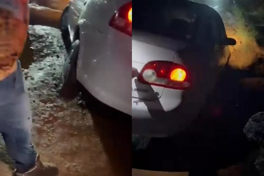 Buracos tornam Avenida Paraíba intransitável e veículo fica preso em via do bairro dos Estados na noite desta segunda-feira (20), em Patos